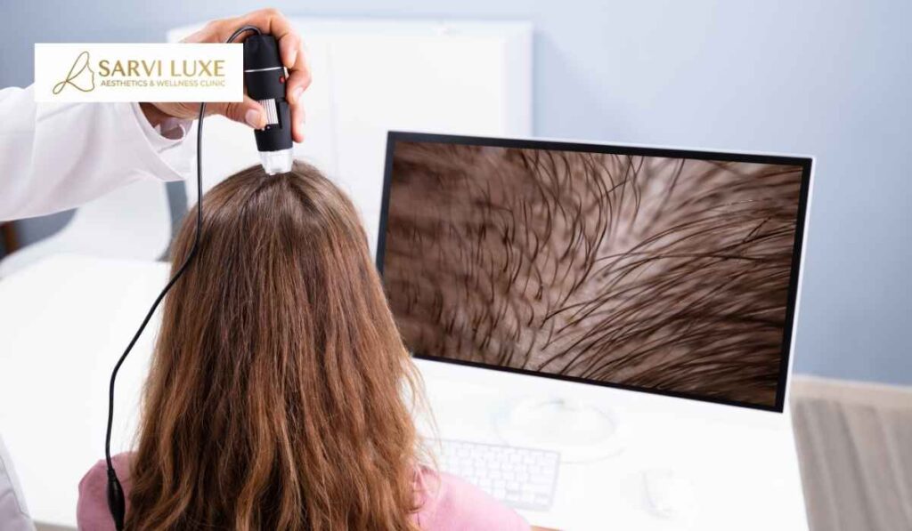 Hair loss specialist examining the scalp health of a patient at Sarvi Luxe hair fall treatment clinic in Ashok Vihar, Delhi